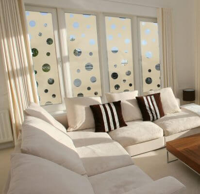 Sandstone Portholes decorating living room windows