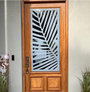 Custom tropical design decorating glass of door.