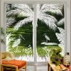 Sliding glass doors that are 8 ft tall decorated with Heron Hideaway decorative window film.